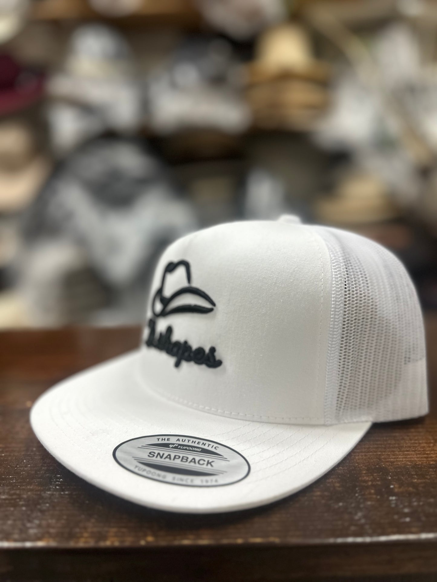 D. Shapes White Trucker Hat